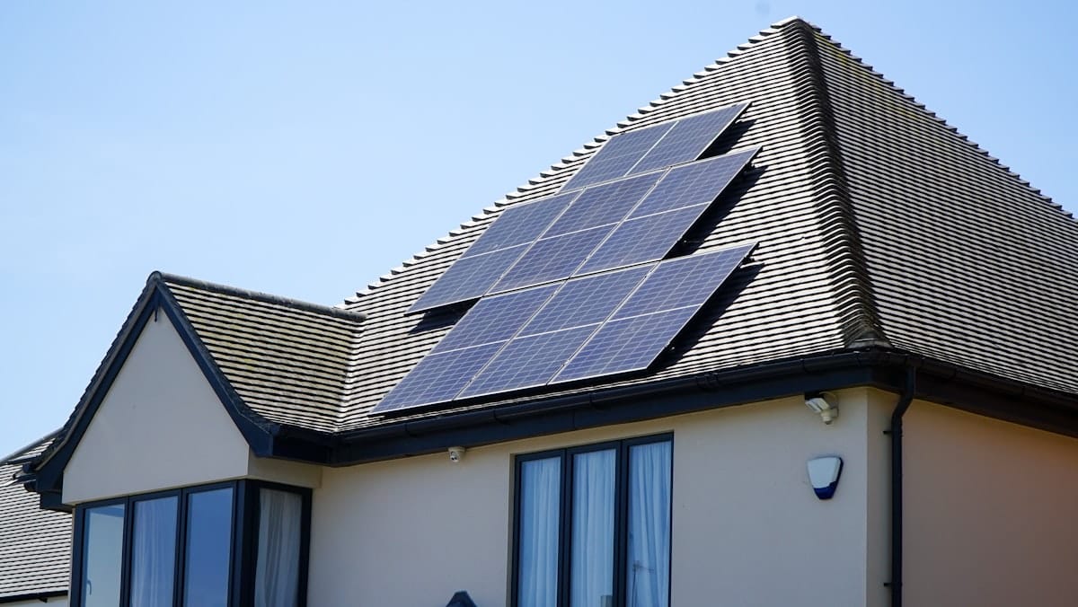 A south-facing roof with solar PV panels — the kind we can size from satellite imagery